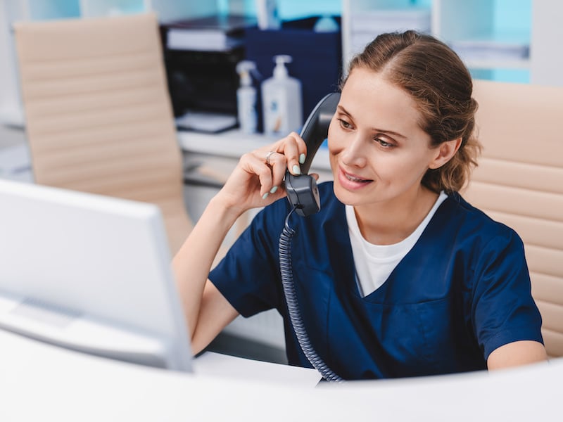 DME provider smiling as she easily finds a patient's orders through the automated system
